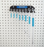 Park Tool THH-H T-Handle Hex Wrench Holder mounted on wall, designed for organizing THH-1 set in a workshop setting.