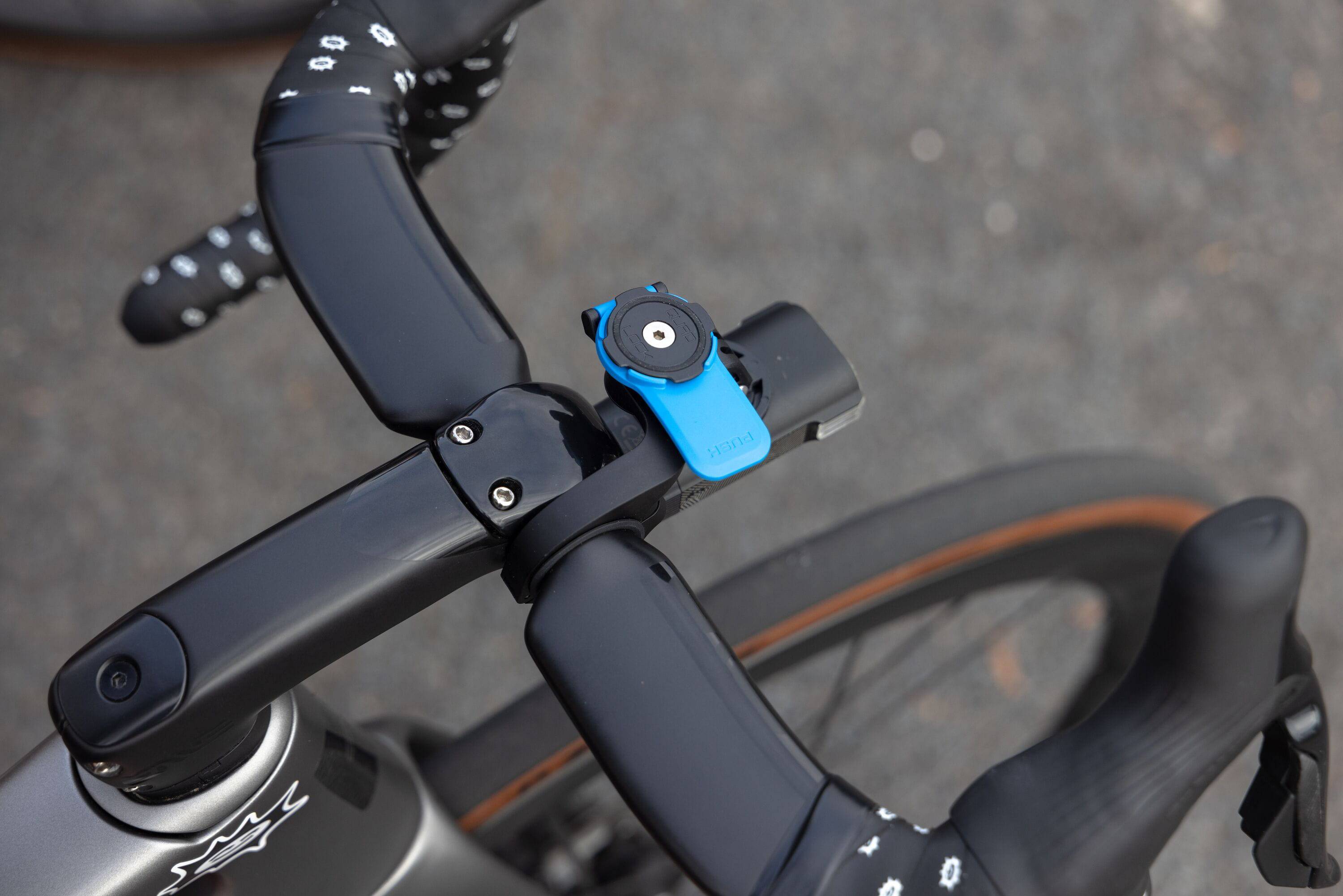 Quad Lock light camera adaptor for GoPro and action cams, mounted on a compatible accessories setup with a sleek design.