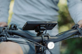 Quad Lock waterproof wireless charging head accessory for secure bike phone mounting, compatible with Quad Lock bike mounts.