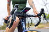 Quad Lock Out Front Mount V3 for smartphones, showing the modular accessory-compatible mounting device attached to a smartphone.