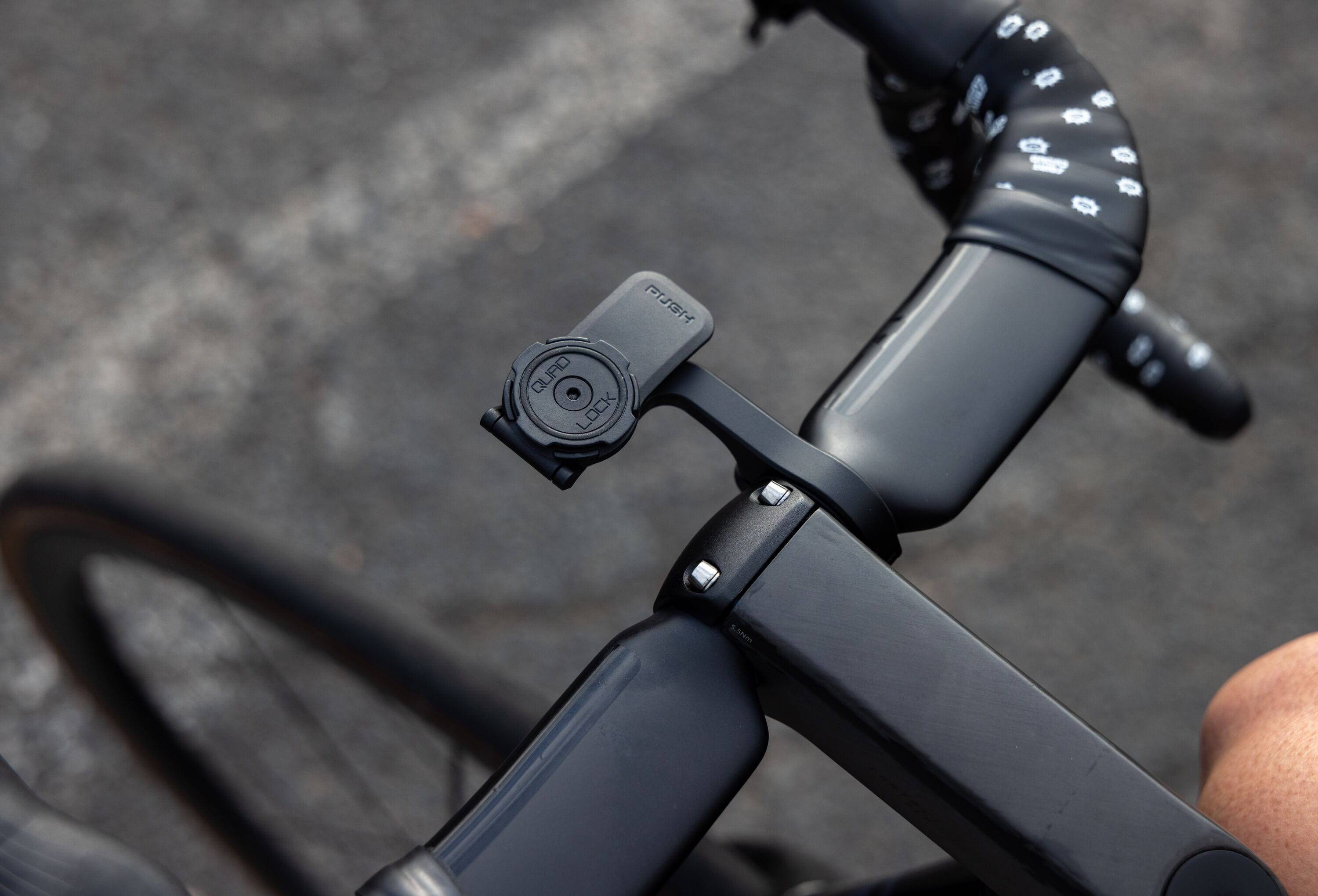 Quad Lock Out Front Mount Pro V2 bike phone mount with secure grip and 360° rotation for easy access and visibility.