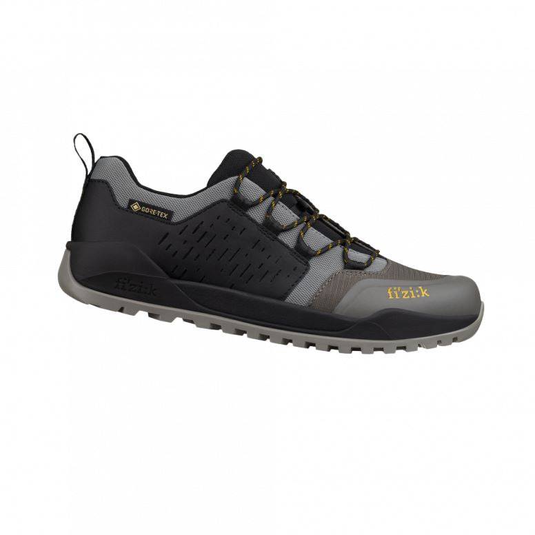 Fizik Terra Ergolace GTX waterproof flat MTB shoes with Vibram outsole, shown in black with rugged design and secure fastening.