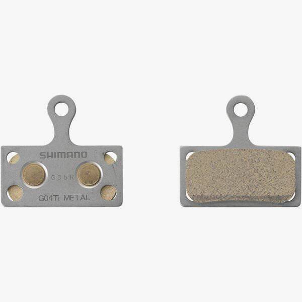 Shimano G04Ti-MX metal sintered disc brake pads with titanium back and spring for bike braking components.
