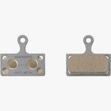 Shimano G04Ti-MX metal sintered disc brake pads with titanium back and spring for bike braking components.