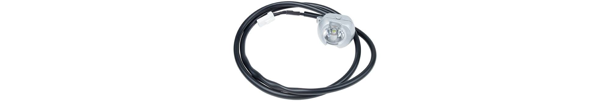 Trek bike headlight and wire harness replacement components for bike lighting accessories, showing wiring and connector parts.