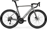 Merida Reacto 6000 road bike with Shimano 105 Di2 electronic shifting and disc brakes, showing the sleek frame and drop handlebars.
