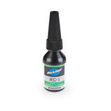 Park Tool RC-1 Green Press Fit Retaining Compound for non-threaded bike parts, shown in a workshop setting
