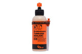 Orange Seal Endurance tubeless sealant in a container, designed for puncture protection and cold weather cycling use.