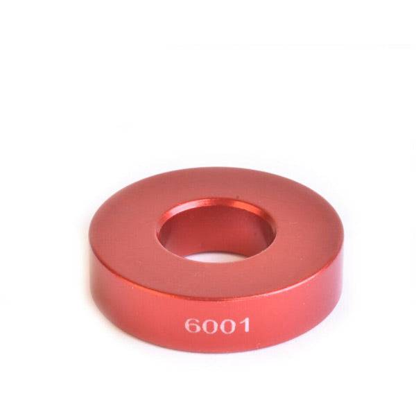 Wheels Manufacturing Drift tool for 6001 bearings and 12mm axles, compatible with WMFG Over Axle Kit, shown in workshop setting