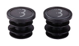 Pair of BBB BHT-92S black handlebar end caps with BBB logo, designed for bike bar tape security, shown on a bicycle handlebar.