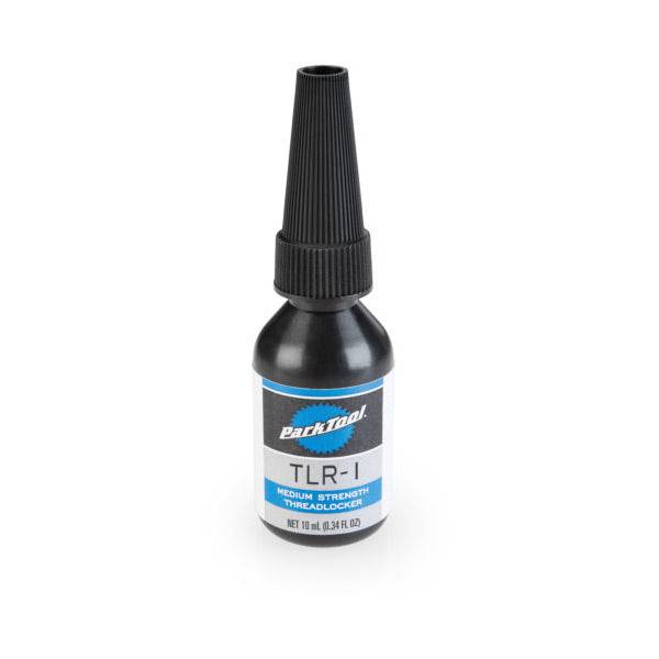 Park Tool TLR-1 medium strength threadlocker bottle for steel, aluminium, and carbon fiber bike components in workshop setting
