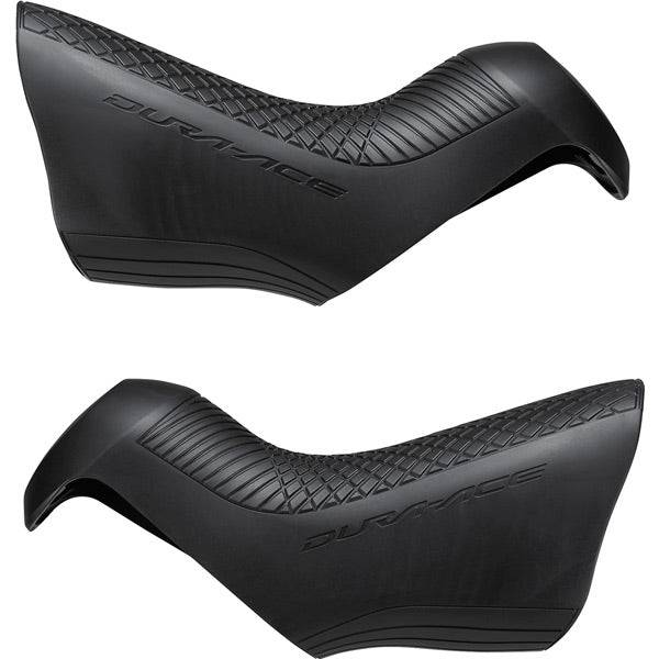 Pair of Shimano Dura-Ace ST-R9150 shifter bracket covers for replacement components on high-performance road bike shifters.
