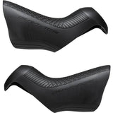 Pair of Shimano Dura-Ace ST-R9150 shifter bracket covers for replacement components on high-performance road bike shifters.