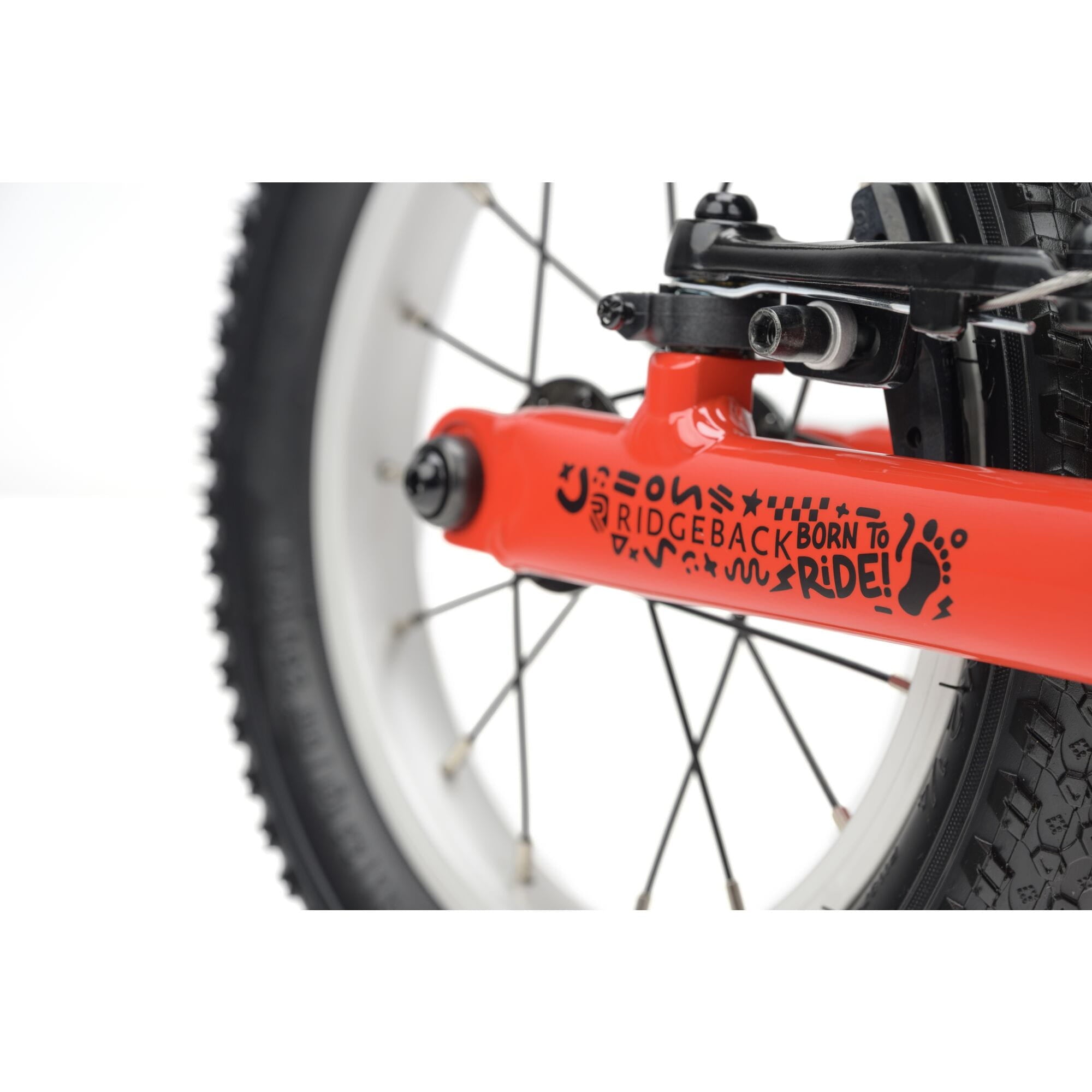 Red Ridgeback Scoot 2027 kids balance bike for toddlers age 2+, showing the sleek frame and handlebars designed for young children.