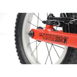 Red Ridgeback Scoot 2027 kids balance bike for toddlers age 2+, showing the sleek frame and handlebars designed for young children.