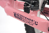 Pink Ridgeback Scoot 2027 kids balance bike for toddlers age 2+, close-up of the frame and handlebar details.