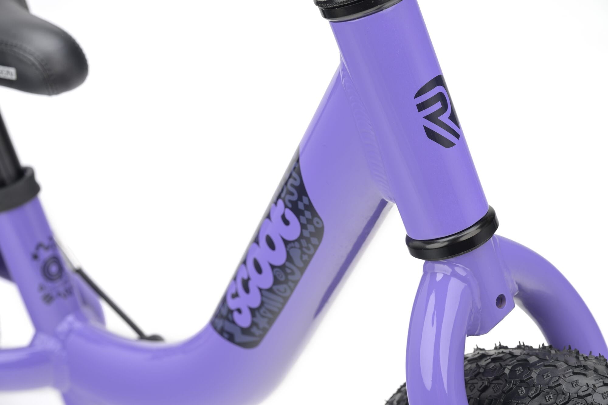 Ridgeback Scoot 2027 kids' balance bike for toddlers, lilac color, close-up of frame and handlebar details.