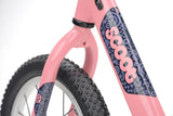 Pink Ridgeback Scoot XL kids balance bike with 14-inch wheels, designed for beginner riders aged 3 and up.