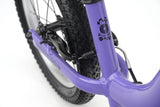 Ridgeback Scoot XL 14-inch kids' balance bike in lilac, designed for beginner riders aged 3 and up.