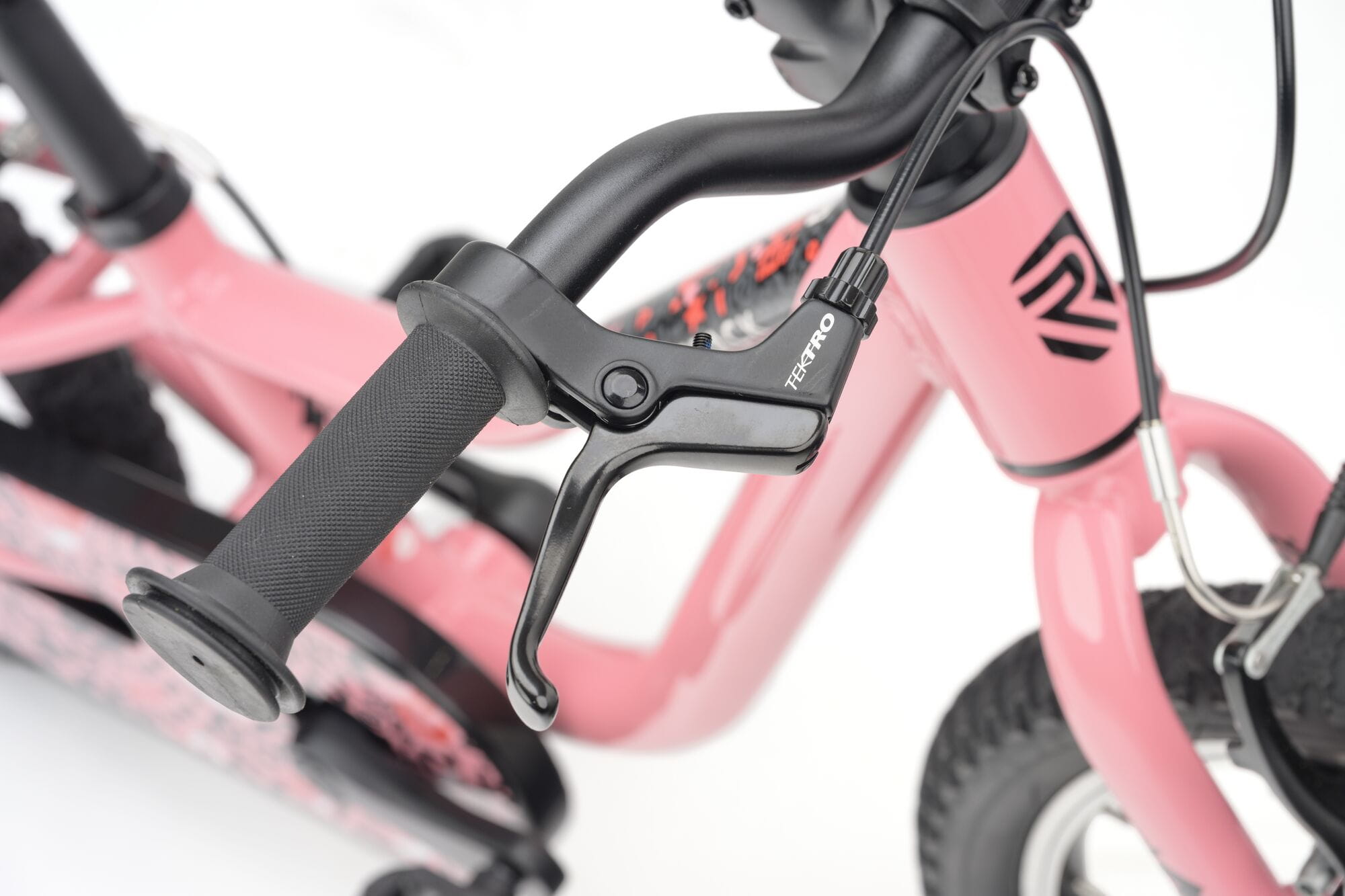 Pink Ridgeback MX16 kids bike with 16-inch wheels, suitable for ages 3.5 to 6, featuring adjustable handlebars and training wheels.