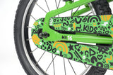 Green Ridgeback MX16 kids bike with adjustable 16-inch wheels for ages 3.5 to 6, featuring a sturdy frame and training wheels.