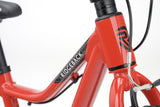 Red Ridgeback MX16 kids bike with adjustable 16-inch wheels, suitable for children aged 3½ to 6 years, close-up detail shot.