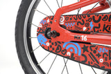 Ridgeback MX16 kids bike with red frame, adjustable 16-inch wheels, suitable for children aged 3.5 to 6 years, close-up detail