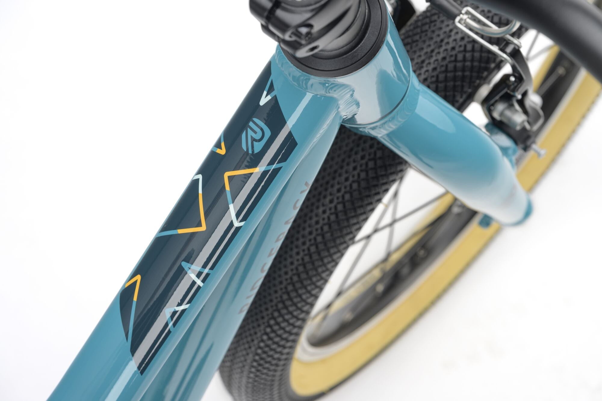 Ridgeback Dimension 16 kids' teal bike for ages 3.5 to 6, lightweight frame with adjustable features for young riders.