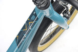 Ridgeback Dimension 16 kids' teal bike for ages 3.5 to 6, lightweight frame with adjustable features for young riders.