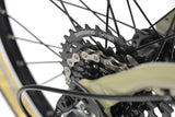 Ridgeback Dimension 20 Kids Bike for ages 5+ with 7-speed Shimano gears in sand color, showing the bike's frame and gear details.