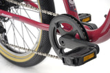 Ridgeback Dimension 20 Kids Bike with plum frame and 7-speed Shimano gears, designed for children aged 5 and older.