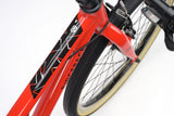 Red Ridgeback Dimension 24 Kids Bike with 8-speed Shimano gears, puncture-resistant tires, and adjustable fit for children ages 8+.