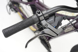 Ridgeback Dimension 24 kids' bike in violet with 8-speed Shimano gears and puncture-resistant tires, adjustable for ages 8+