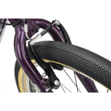Ridgeback Dimension 24 kids' bike with violet frame, 8-speed Shimano gears, puncture-resistant tires, adjustable fit for ages 8+