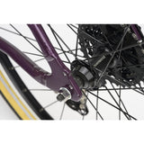Ridgeback Dimension 24 kids' bike with violet frame, 8-speed Shimano gears, puncture-resistant tires, adjustable fit for ages 8+