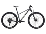 Giant Talon 29 1 mountain bike with Shimano CUES U6000 disc brakes, unisex MTB, black and red frame, ready for trail riding.