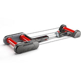 Elite Quick-Motion Rollers foldable indoor cycling trainer with magnetic resistance, showing the compact design and adjustable rollers.
