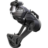 Shimano XTR RD-M9250 Di2 Wireless 12-speed rear MTB derailleur with SGS HYPERGLIDE technology, mounted on a mountain bike.