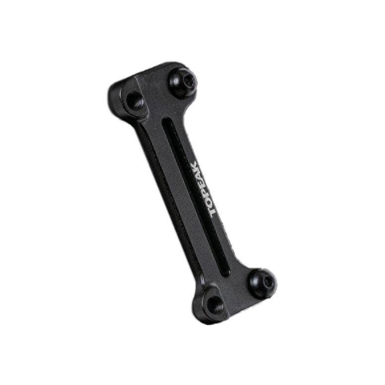 Topeak Cage Mount Expander in black for water bottle cages and pump brackets, accessory mounted on bicycle frame.