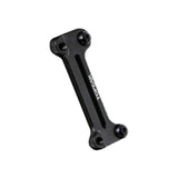 Topeak Cage Mount Expander in black for water bottle cages and pump brackets, accessory mounted on bicycle frame.