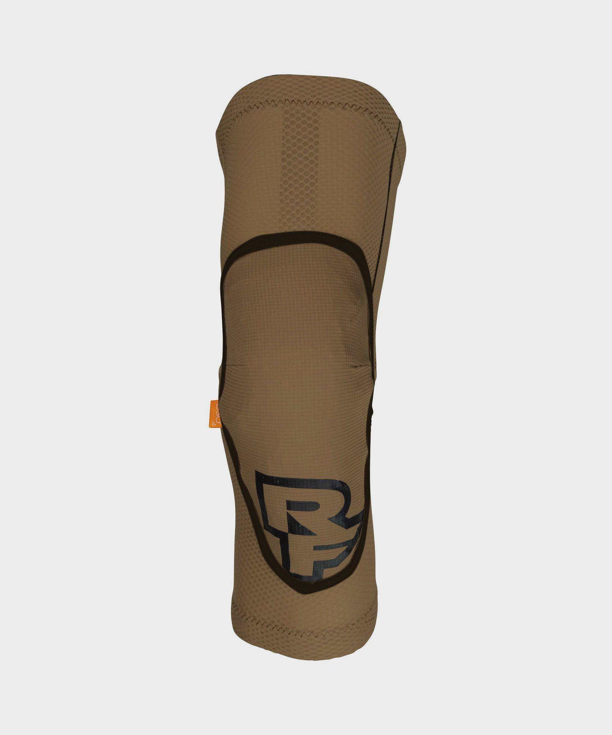 Race Face Covert Knee Guard with CE Certified D3O protection and breathable design, shown on a model for cycling safety.