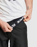 Race Face Traverse 2022 black mountain bike shorts with zippered pockets, lightweight and breathable cycling clothing for men.