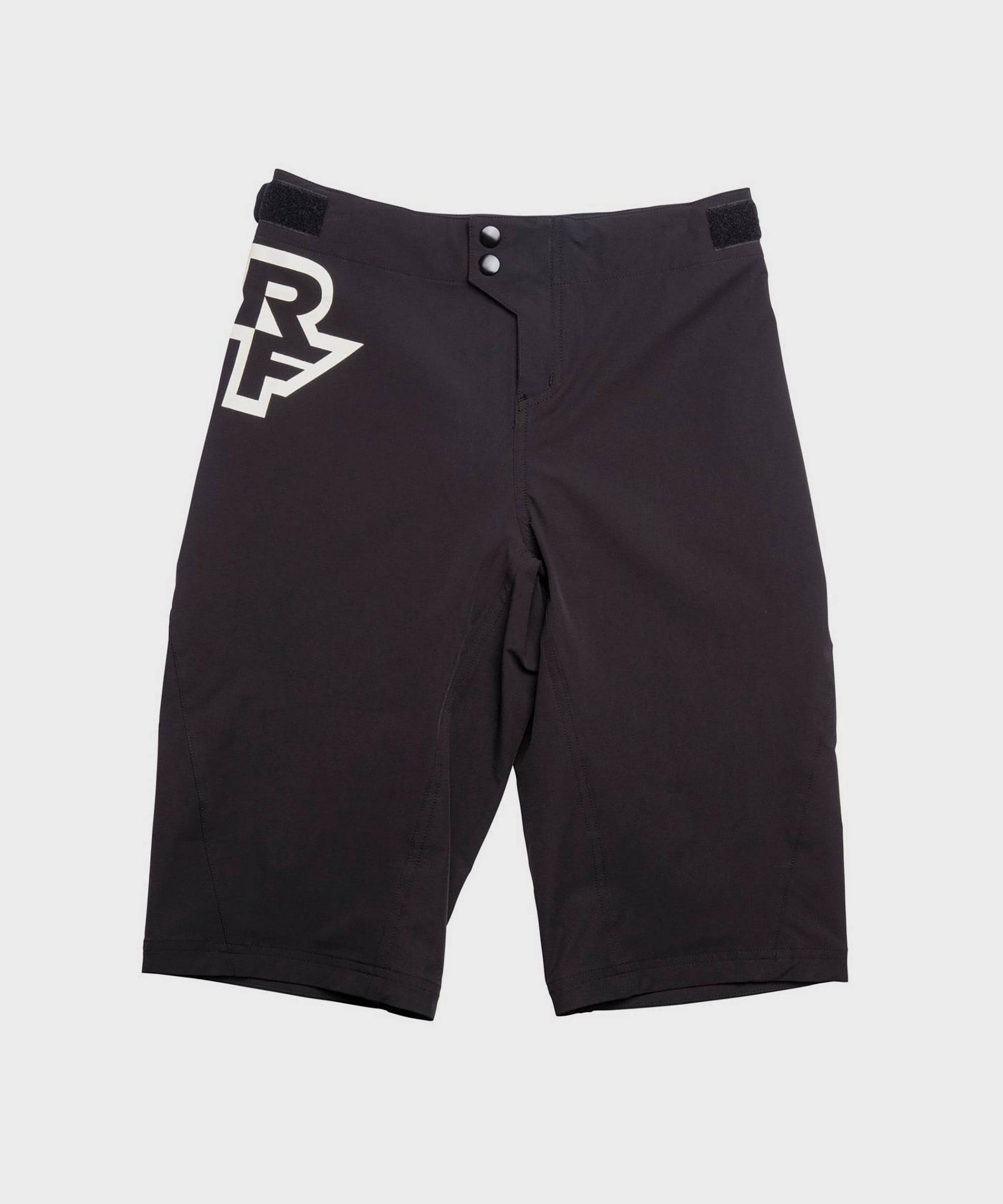 Race Face Sendy Youth Mountain Bike Shorts with adjustable waist and zippered pockets, designed for active kids.