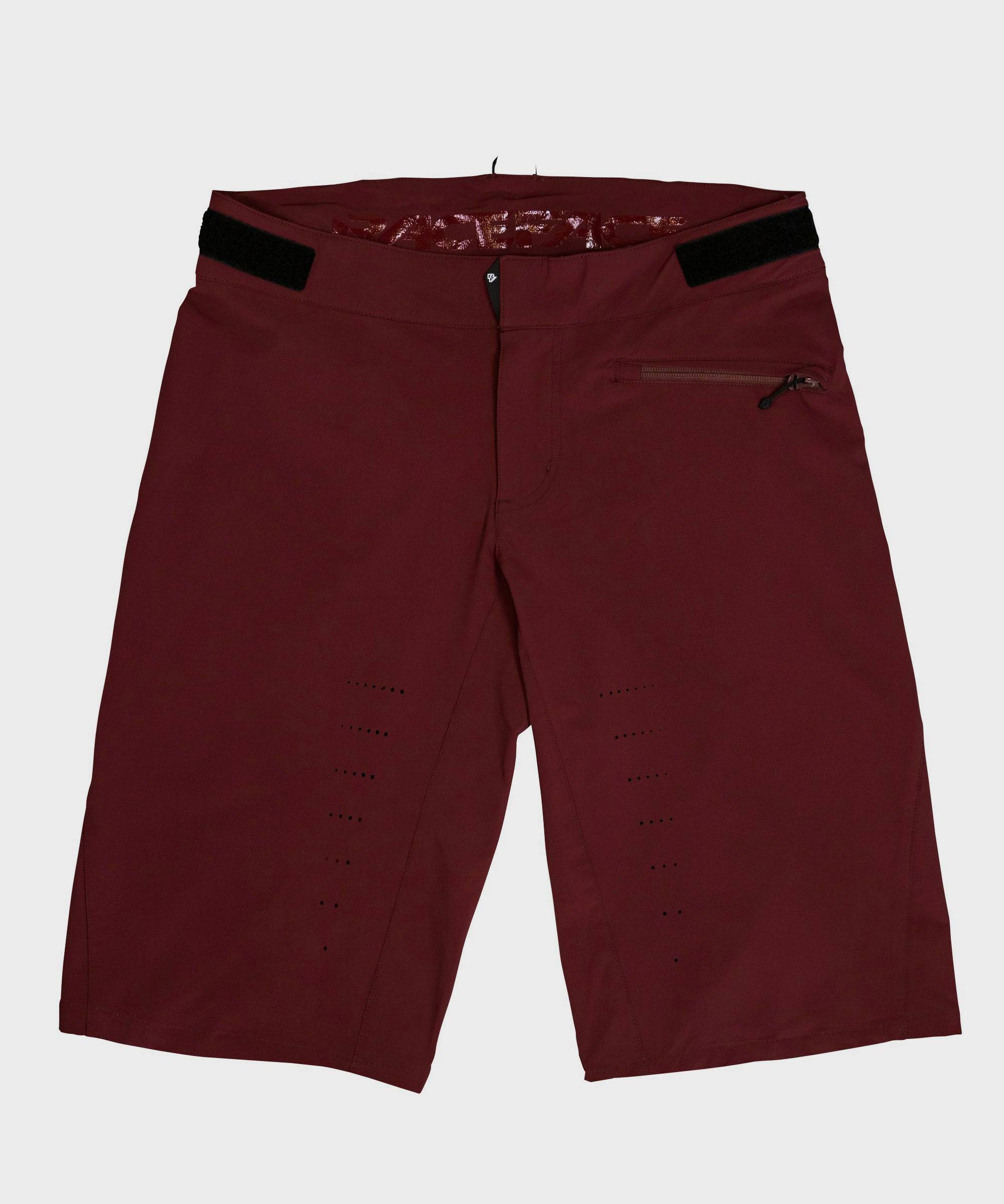 Race Face Indy Women’s All-Mountain Shorts with venting and adjustable waistband, showcased on a model in outdoor setting.