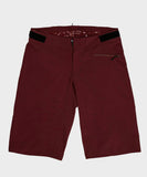 Race Face Indy Women’s All-Mountain Shorts with venting and adjustable waistband, showcased on a model in outdoor setting.