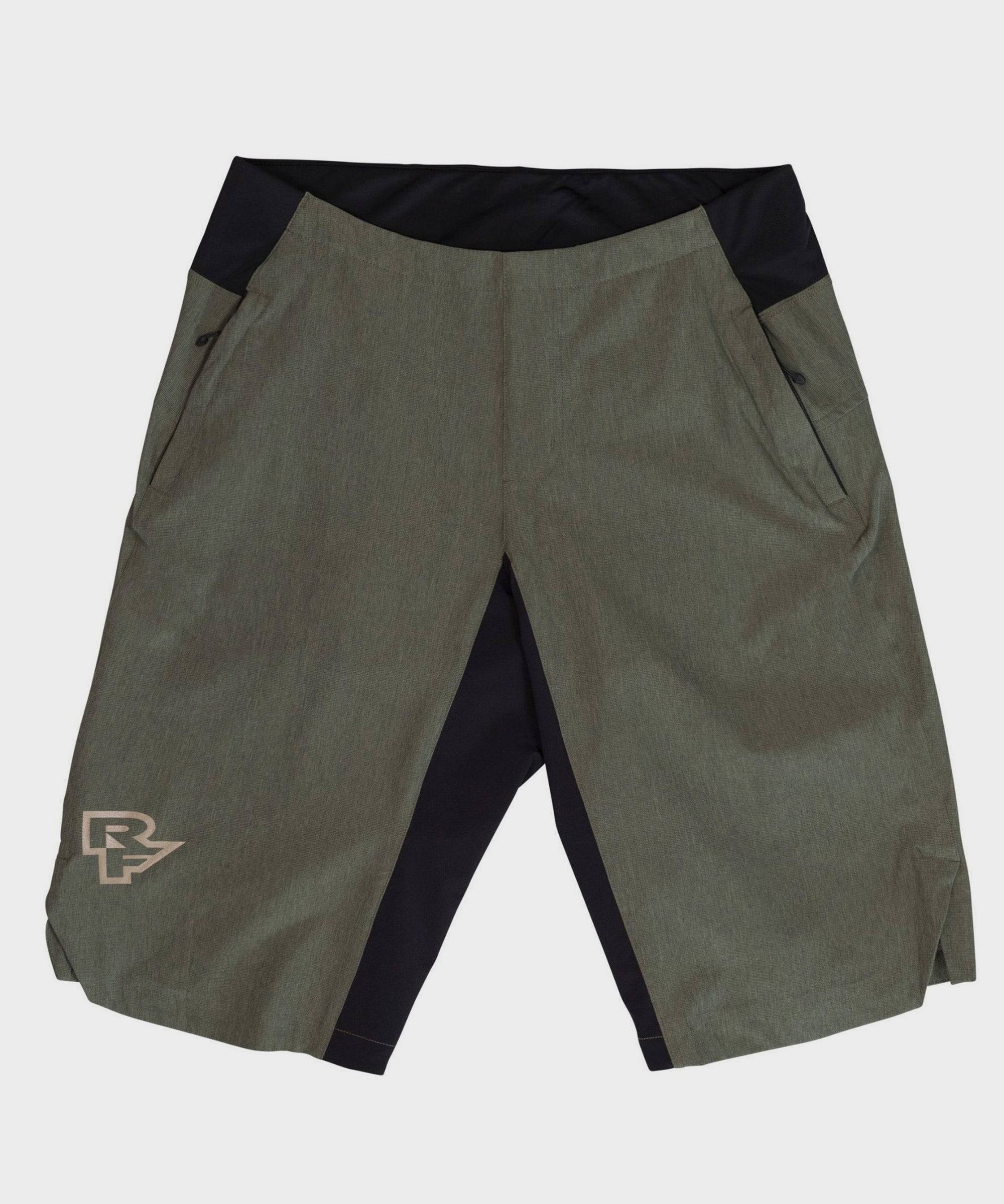 Race Face Traverse 2022 black mountain bike shorts with zippered pockets, lightweight and breathable cycling clothing for men.