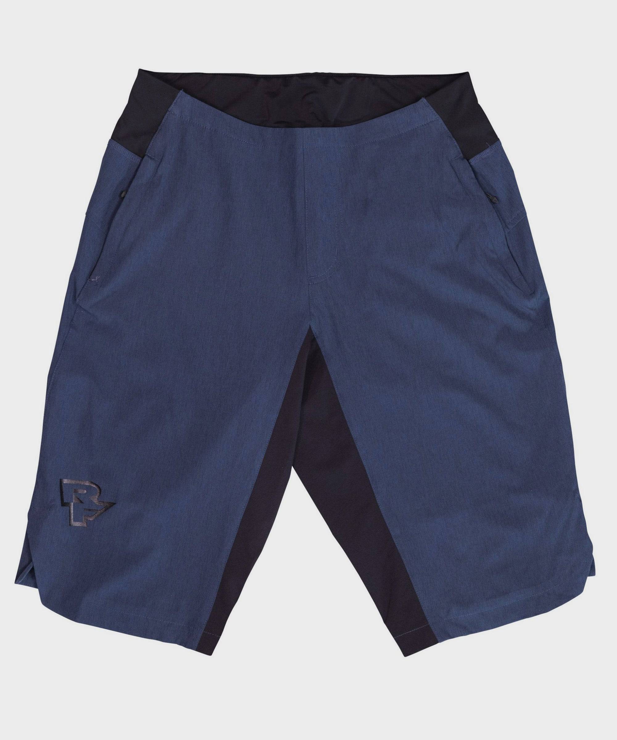 Race Face Traverse women's mountain biking shorts with zippered pockets and ventilation, designed for outdoor cycling comfort.