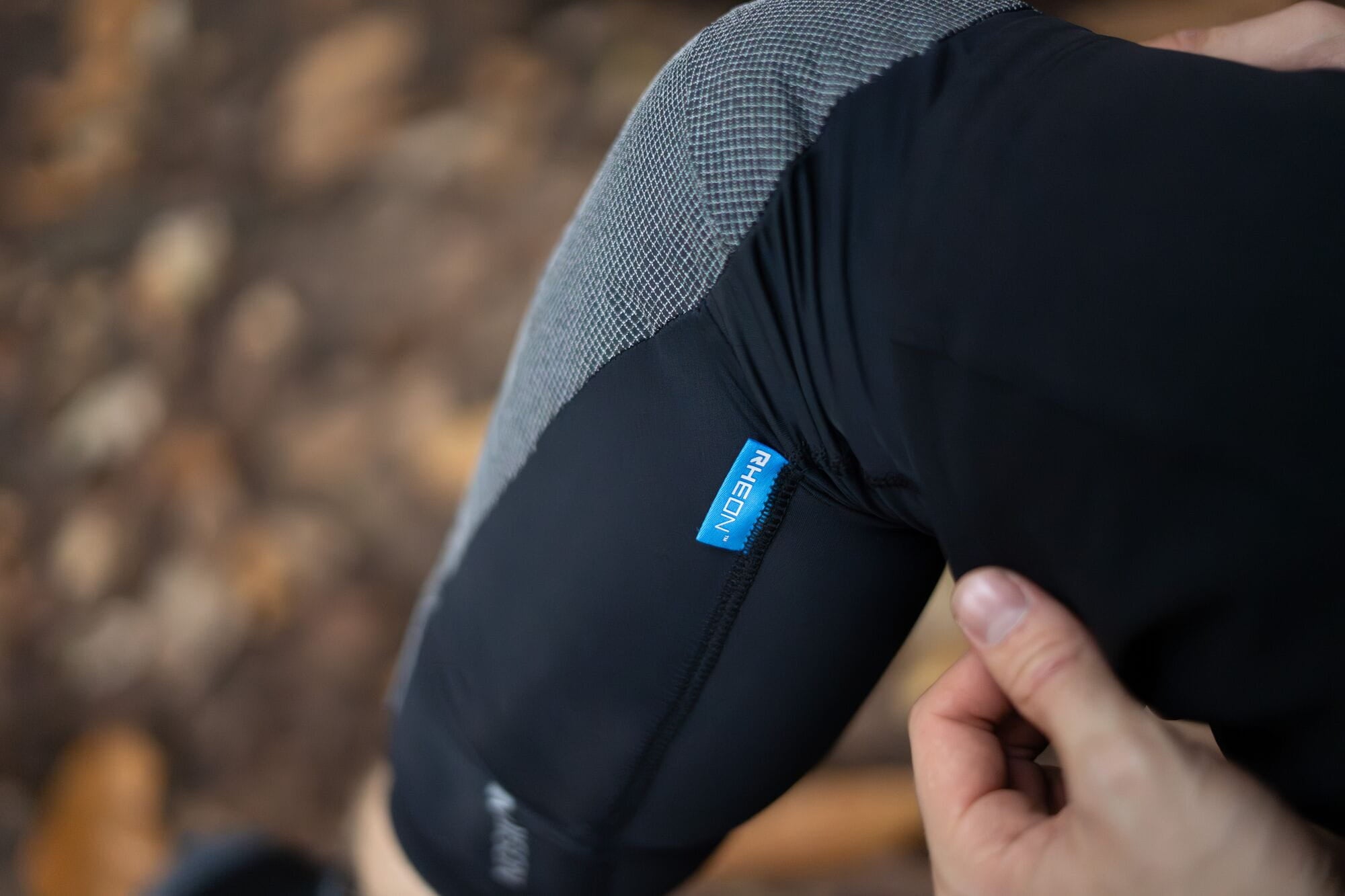 Madison RHEON Level 2 Elbow Pad Set for mountain biking protection, showing padded elbow guards in black with adjustable straps.