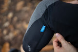 Madison RHEON Level 2 Elbow Pad Set for mountain biking protection, showing padded elbow guards in black with adjustable straps.