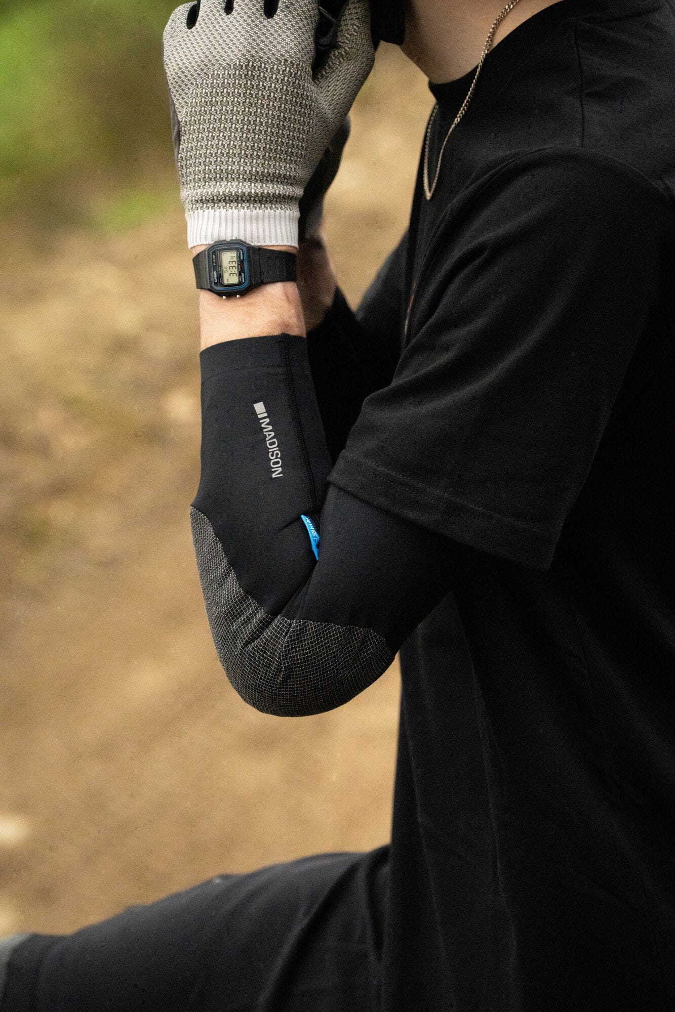 Madison Flux Ultra Light Level 1 RHEON mountain bike elbow pad set with adjustable straps and protective padding.